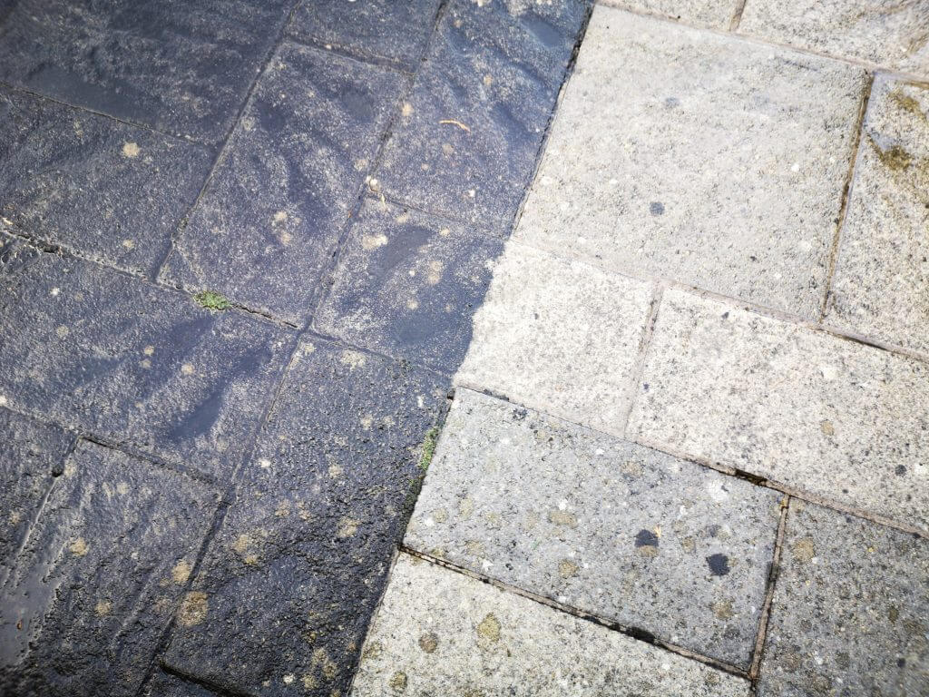 Pressure cleaning stained pavers