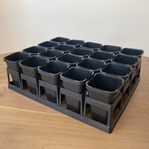 The side of a 20-Cell Air Pruning Tray with 68mm Plastic Plant Tube Pots Seedling Propagation